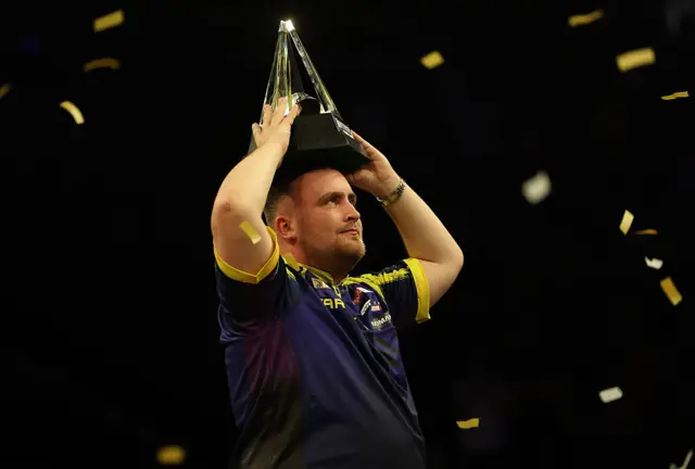 Luke Littler with the Premier League trophy