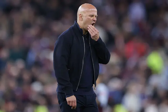 Arne Slot, head coach of Liverpool, looks dejected