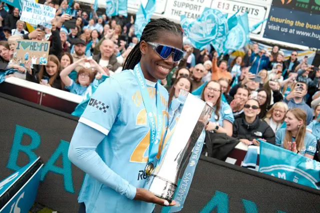 Khadija Shaw of Manchester City poses for a photo with the WSL trophy