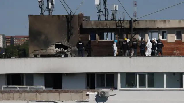 Romanian law enforcement officers work at the site of an explosion in a residential block of flats following a reported drone strike near the border with Ukraine, in Galati, Romania, May 29, 2026