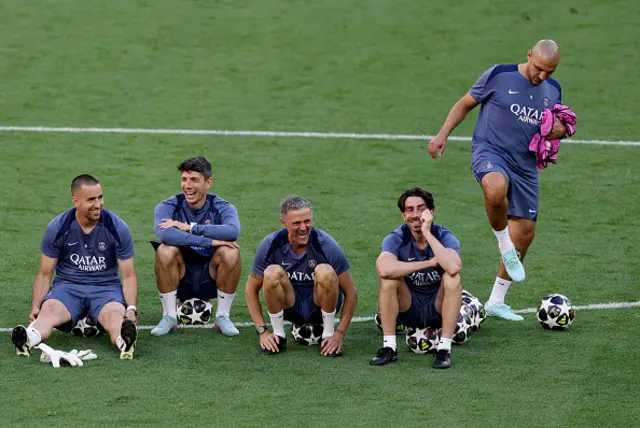 Luis Enrique, Head Coach of Paris Saint-Germain and coaching staff react