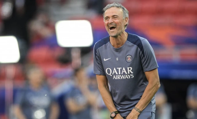 Paris Saint-Germain's head coach Luis Enrique smiles