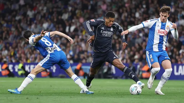 Jude Bellingham fights for the ball with Espanyol's Spanish midfielder #08 Edu Exposito
