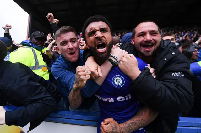 Tobi Adebayo-Rowling of Rochdale celebrates with fans following Devante Rodney of Rochdale (not pictured) scoring his team's second goal