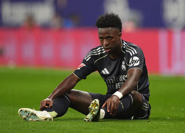 Vinicius Junior of Real Madrid sat on the floor