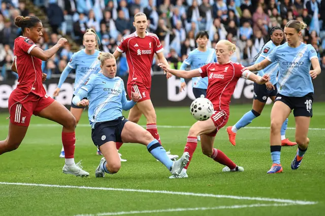 Manchester City's German defender Rebecca Knaak fights for the ball