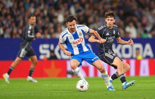 Edu Exposito of RCD Espanyol on the ball while under pressure from Thiago Pitarch of Real Madrid