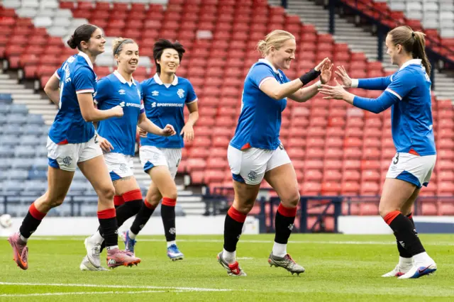 Katie Wilkinson celebrates after scoring her first goal