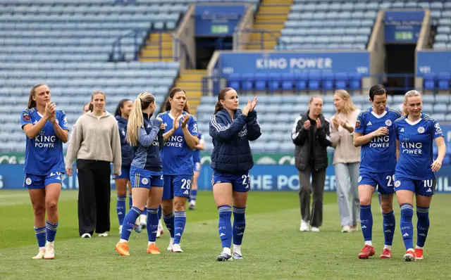 Leicester players clap the fans at full time