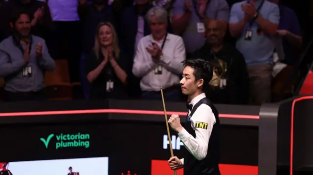 Wu Yize celebrates