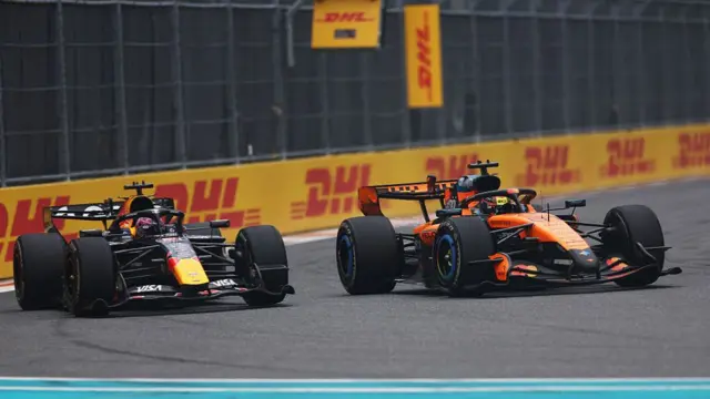 Oscar Piastri overtakes Max Verstappen during the Miami Grand Prix