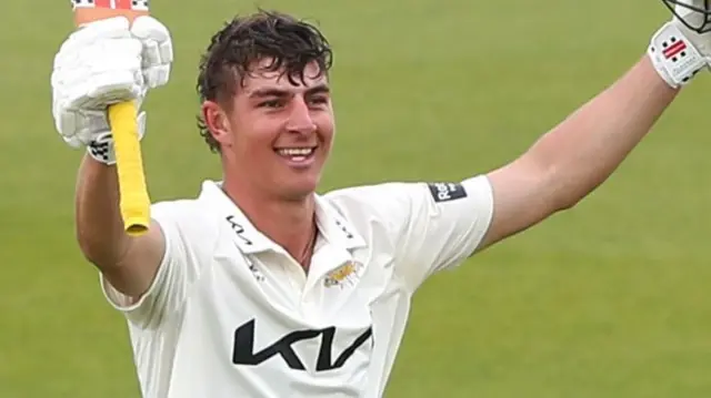Adam Thomas celebrates scoring century