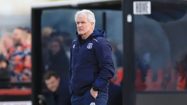 Mark Hughes in the Carlisle dugout