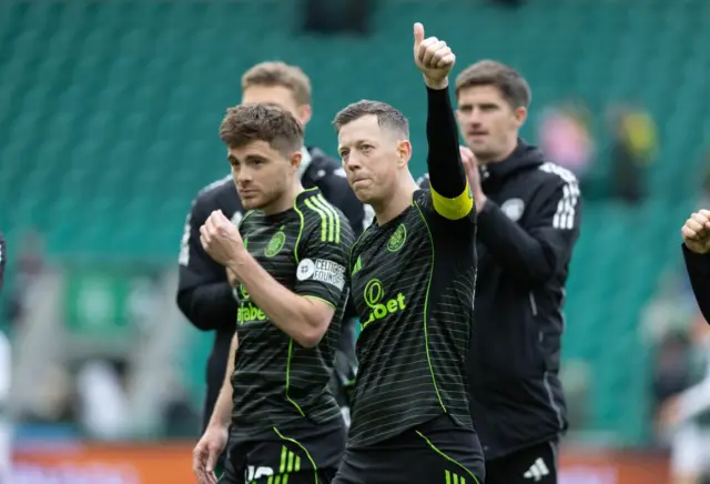 Celtic skipper Callum McGregor salutes the away fans