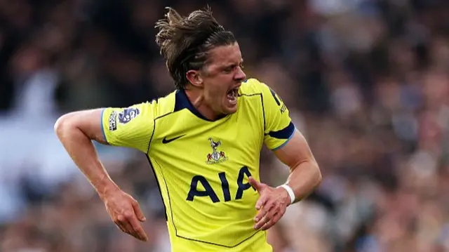 Conor Gallagher celebrates in bright yellow kit