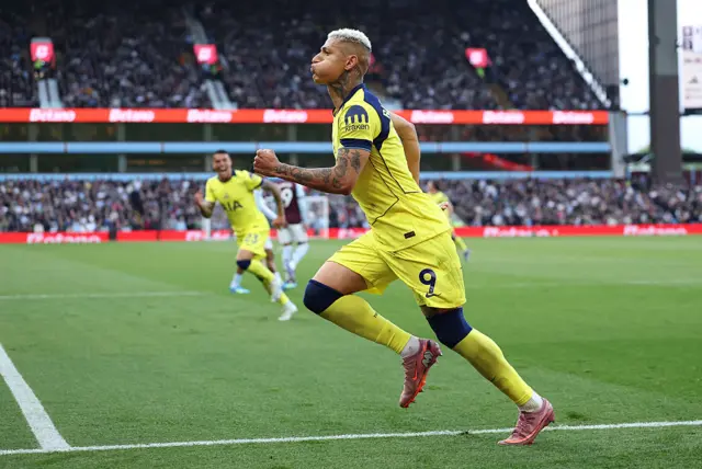 Richarlison celebrates a goal on the pitch