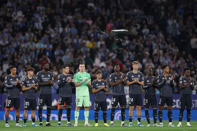 Real Madrid's players observe a minute of silence for late Isidro Oliveras, former head of RCD Espanyol