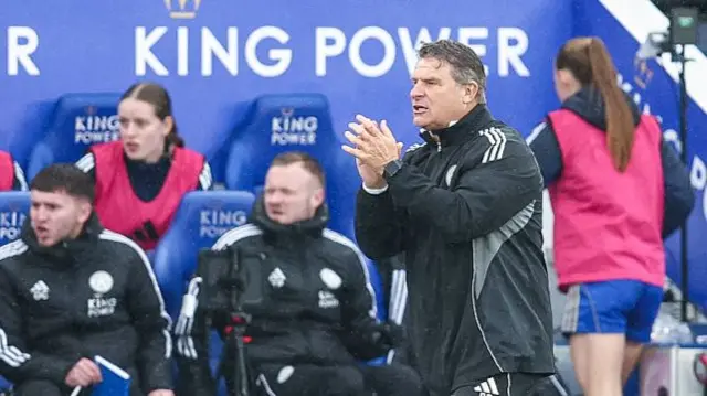 Rick Passmoor appluas his side from the dugout