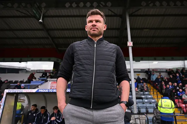 Scunthorpe boss Andy Butler stands on the touchline at Rochdale
