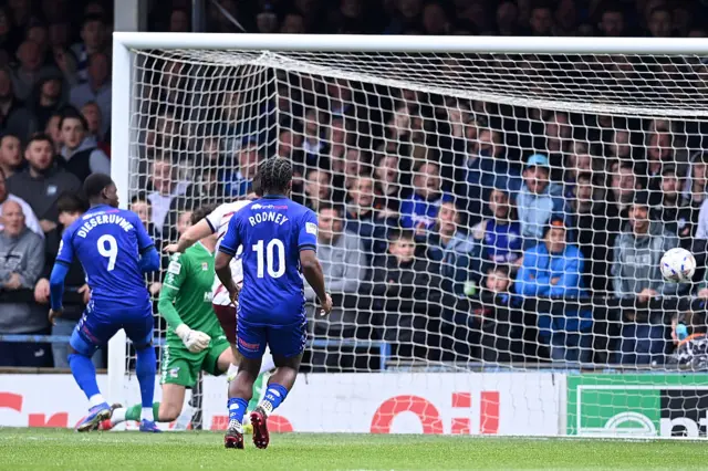 Scunthorpe's Will Evans scores an own goal to give Rochdale the lead