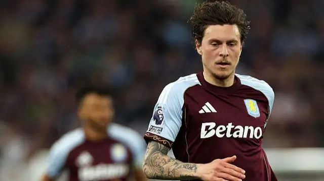 Aston Villa player runs for the ball