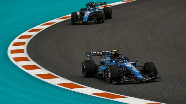 Carlos Sainz leads Alexander Albon driving on track during the F1 Grand Prix of Miami