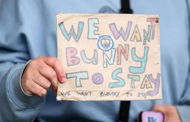 "We want Bunny to stay, we want bunny to stay" sign
