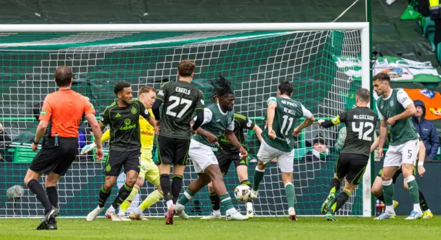 Joe Newell forces a shot home for Hibs