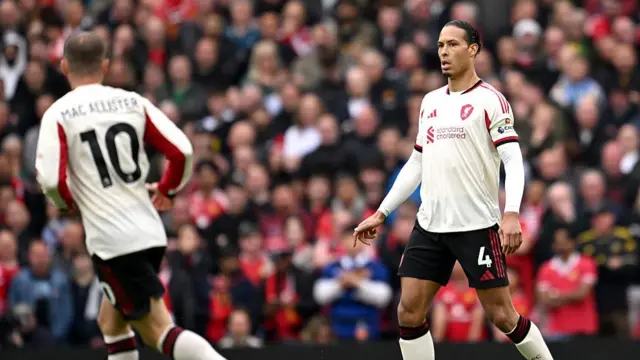 Liverpool players in white kit with red details