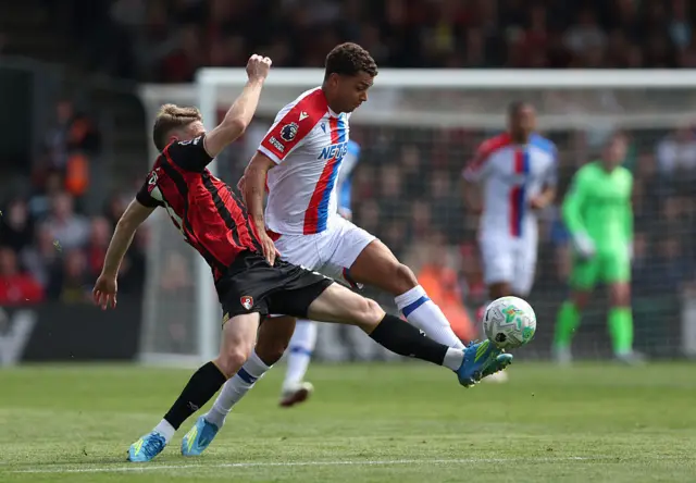 Brennan Johnson in white kit kicking the ball