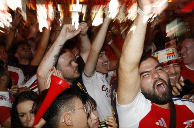 Arsenal fans in London watch the Final