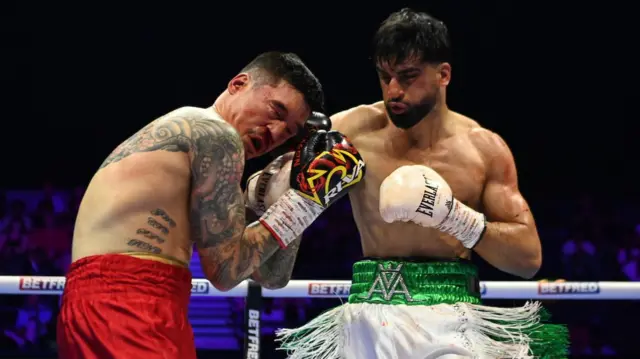 Adam Azim punches Steve Claggett