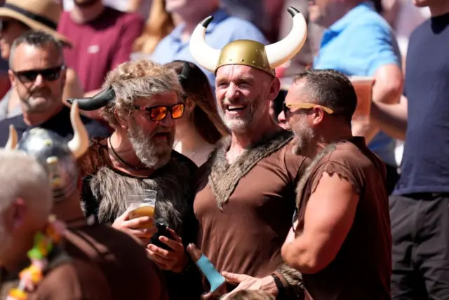 Fans in fancy dress in the stands