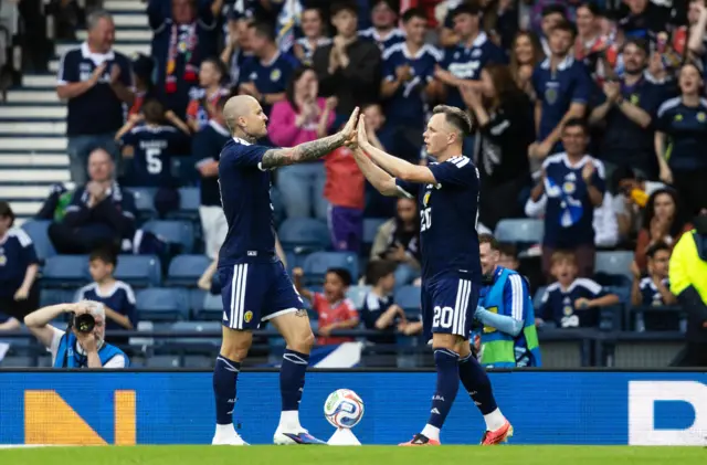 Scotland's Lawrence Shankland celebrates with Lyndon Dykes after scoring to make it 3-1