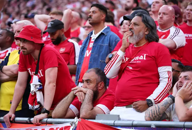 Arsenal fans watch on
