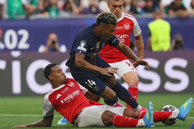 Gabriel Magalhaes and Paris Saint-Germain's French midfielder Desire Doue vie for the ball