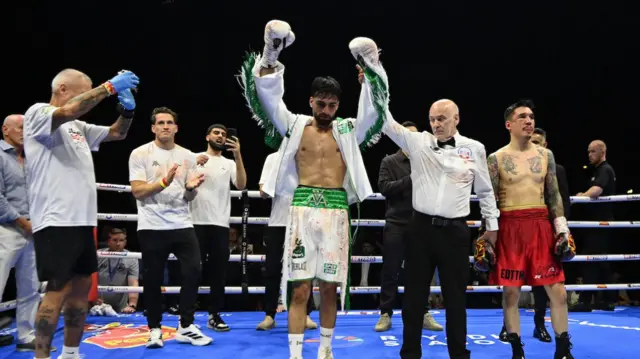 Adam Azim celebrates his victory