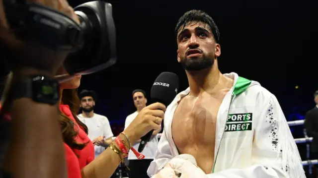 Adam Azim gets interviewed after victory