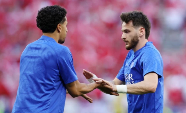 Paris St Germain's Marquinhos and Khvicha Kvaratskhelia during the warm up
