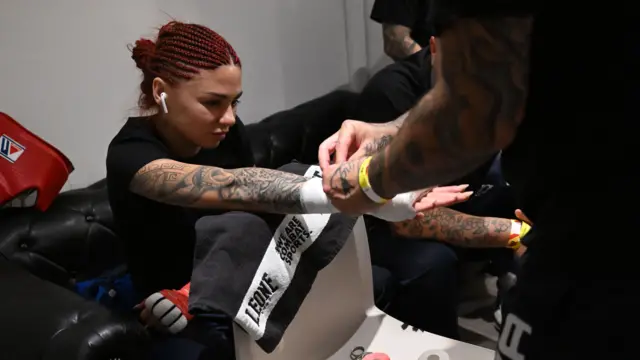 Aurora De Persio gets strapped up before her fight