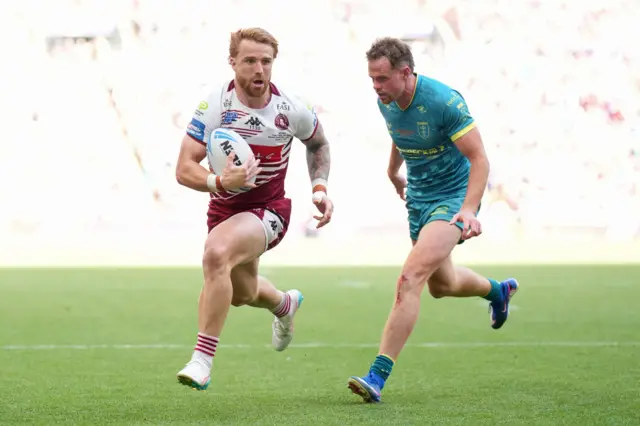 Adam Keighran of Wigan Warriors scores a try