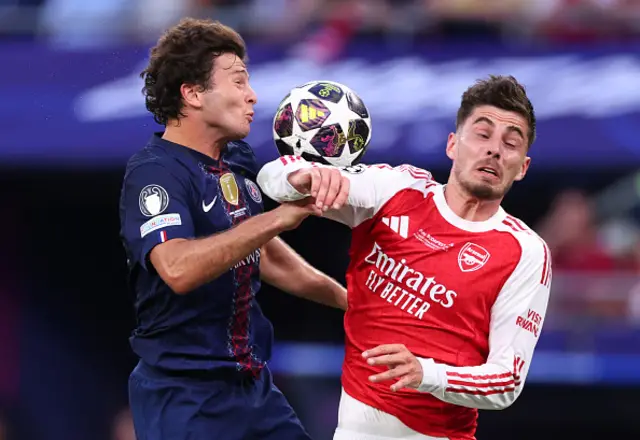 Joao Neves of Paris Saint Germain in action with Kai Havertz