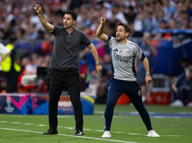 Mikel Arteta, Manager of Arsenal, reacts alongside Nicolas Jover