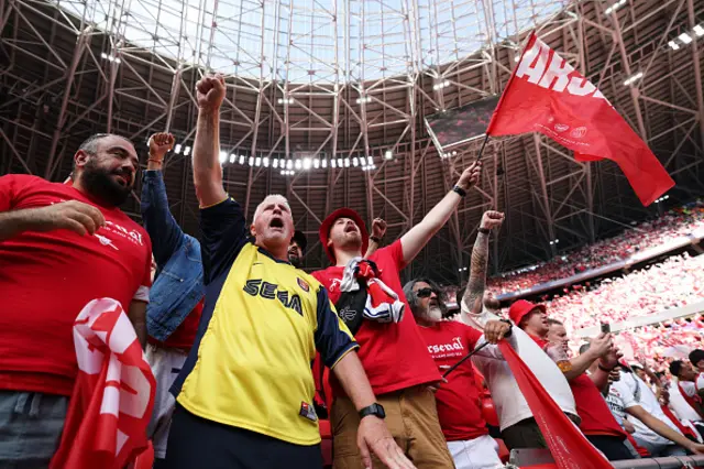 Fans of Arsenal react