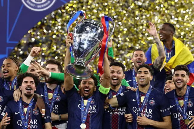 Paris Saint-Germain's Brazilian defender #05 Marquinhos (C) lifts the trophy