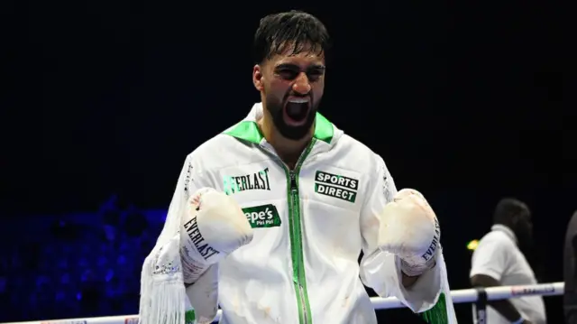Adam Azim celebrates victory