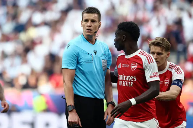 German referee Daniel Siebert (L) looks on
