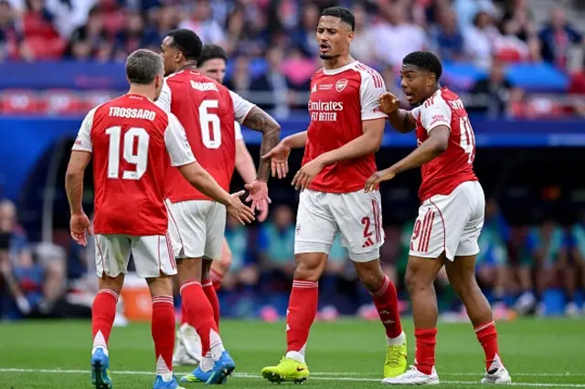 Leandro Trossard, Arsenal's Brazilian defender Gabriel Magalhaes, Arsenal's French defender William Saliba and Arsenal's English midfielder Myles Lewis-Skelly react