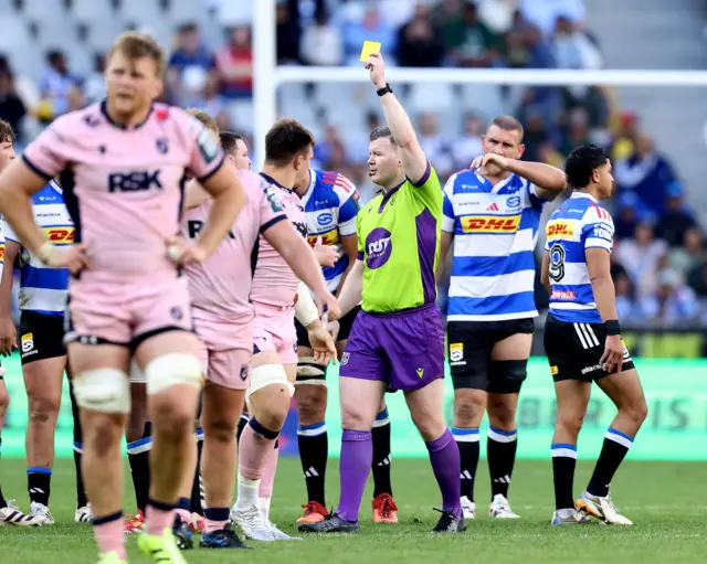 referee shows yellow card