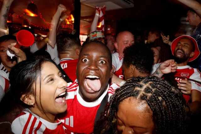 Arsenal fans in London watch the Final